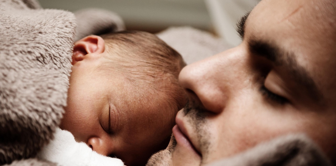 Father and baby sleeping