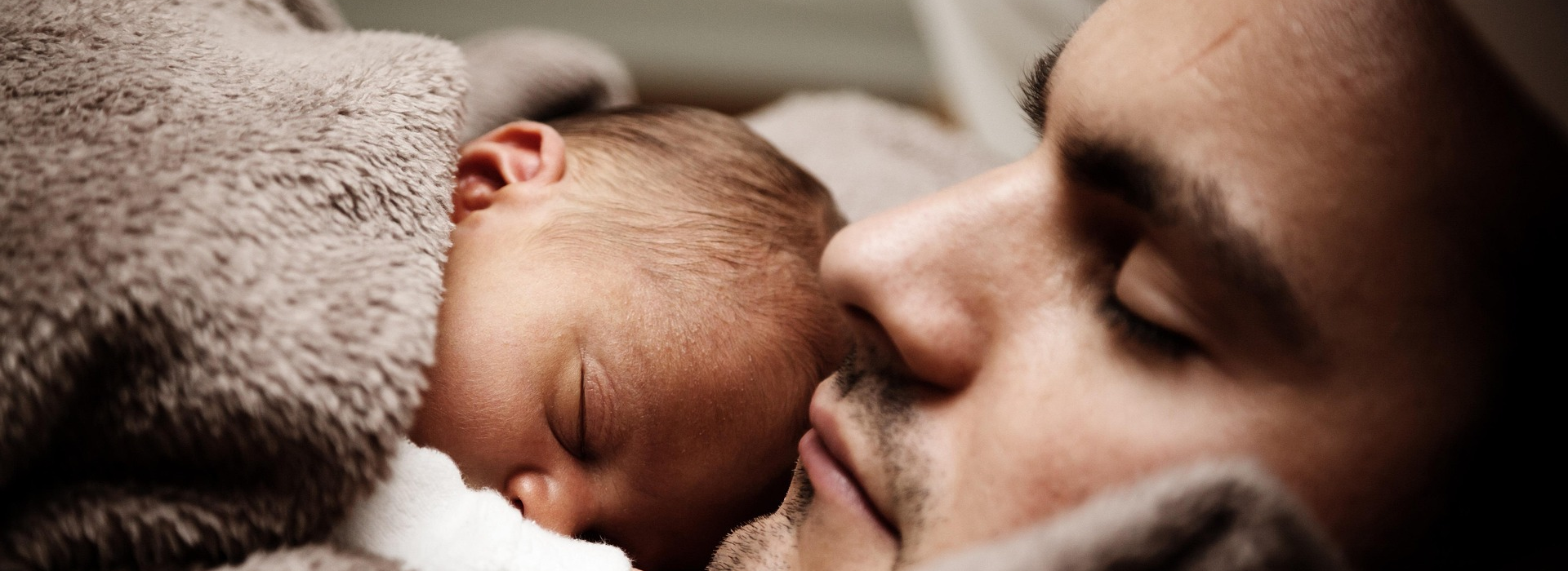 Father and baby sleeping
